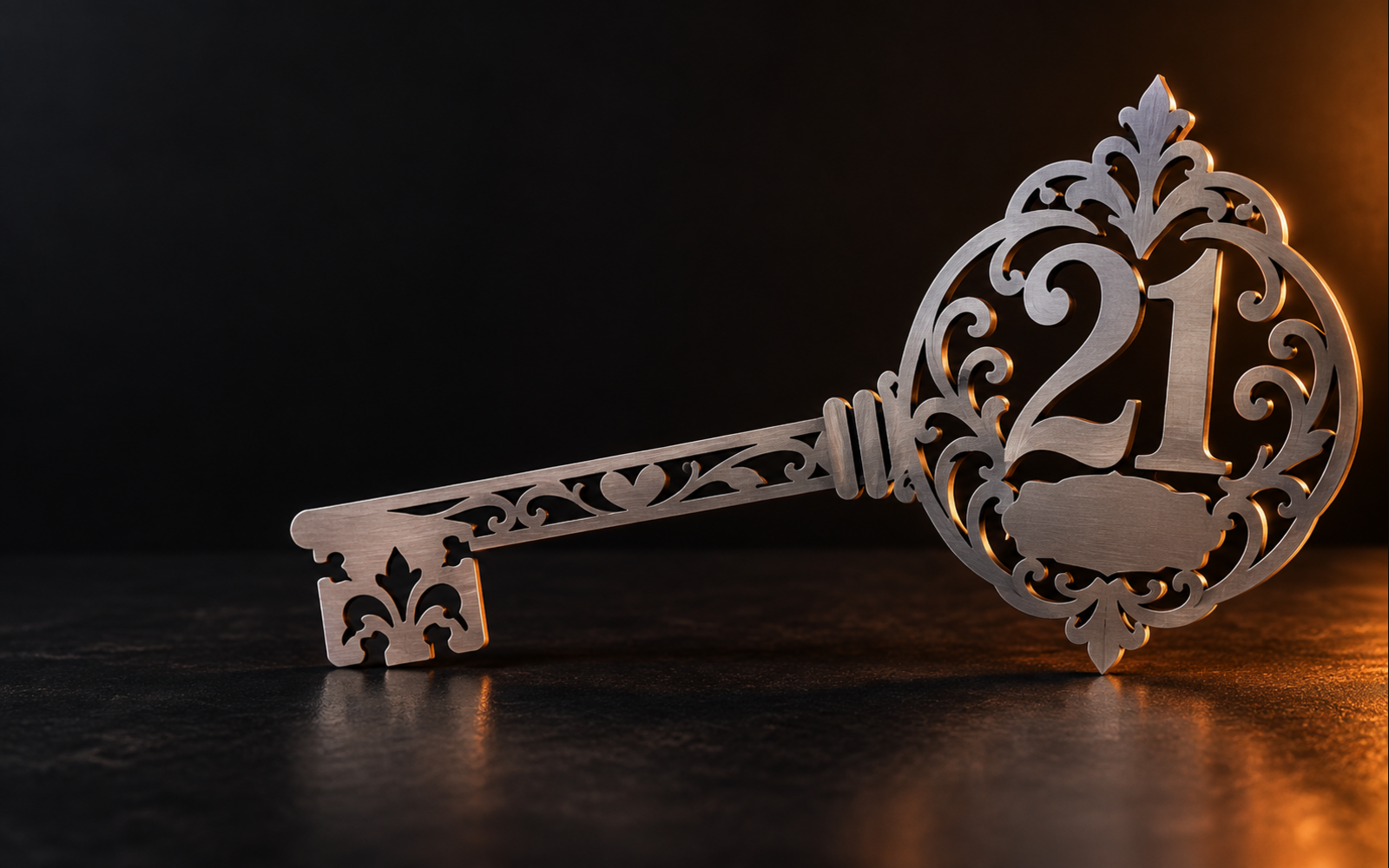 Decorative laser-cut steel 21st birthday key with warm orange lighting